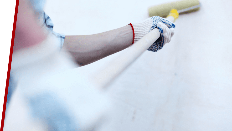 A person holding a baseball bat with one hand.